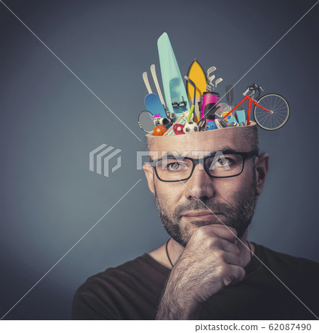 Portrait of man with glasses and hand on chin. 62087490