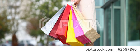 Cute model with colorful shop bags Cute model with colorful shop bags 62087866