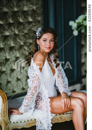 Close-up portrait of young beautiful bride preparing to wedding ceremony 62088646