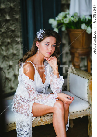 Close-up portrait of young beautiful bride preparing to wedding ceremony Close-up portrait of young beautiful bride preparing to wedding ceremony 62088647