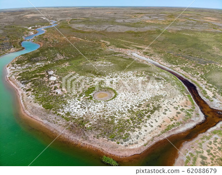Small red water river and green water lake in Bogdo-Baskunchak Nature Reserve 62088679