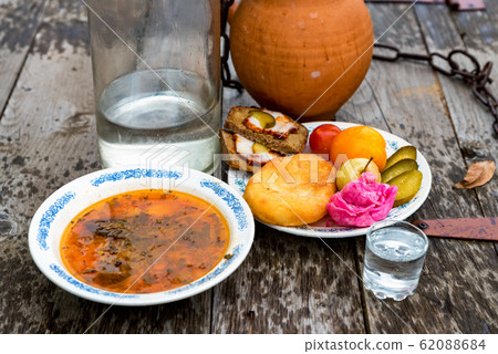 Traditional cossacks' meal with soused cabbage, lardo and poteen 62088684