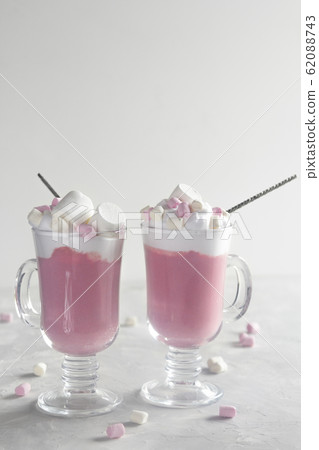 Pink hot chocolate with whipped cream and Pink hot chocolate with whipped cream and 62088743