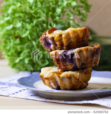 stack of blueberry cheese muffins muffins with 62088782