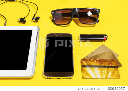 set of modern people accessories on a yellow background 62089057