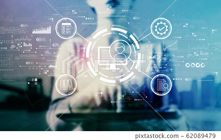 Document management system concept with businesswoman using a tablet Document management system concept with businesswoman using a tablet 62089479
