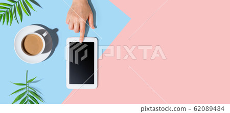 Person using a tablet computer 62089484