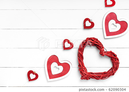 Red hearts corner composition on white wooden Red hearts corner composition on white wooden 62090304