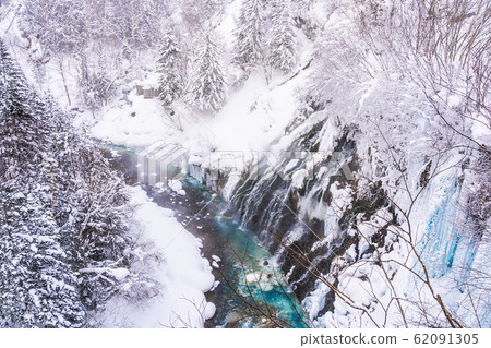 Beautiful outdoor nature landscape with shirahige waterfall and bridge in snow winter season 62091305