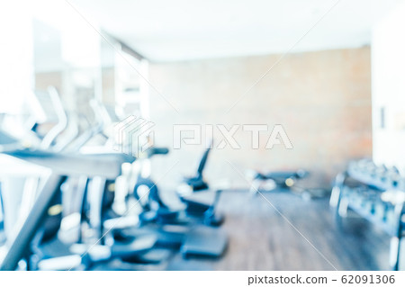 Abstract blur fitness equipment in gym interior Abstract blur fitness equipment in gym interior 62091306