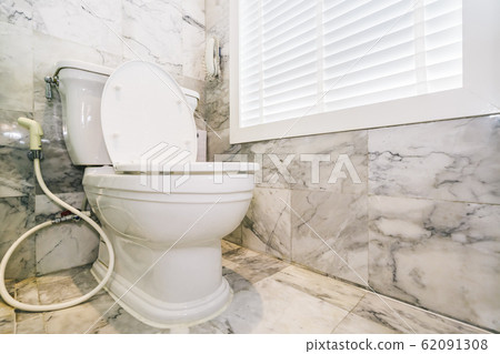 White toilet bowl seat in bathroom White toilet bowl seat in bathroom 62091308
