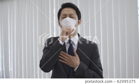 Businessman coughing Businessman coughing 62095375