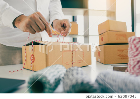 Young asian teenage product owners are packing 62097043