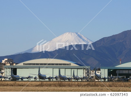 Fuji from the U.S. Navy Atsugi base in Kanagawa prefecture over the Tanzawa Mountains 62097343