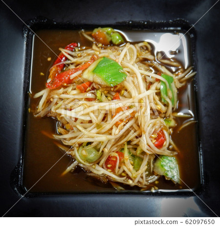 Hot and spicy thai food green papaya salad on Hot and spicy thai food green papaya salad on 62097650