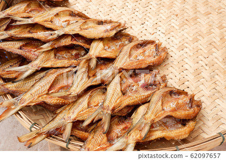 Making dried fish / dry salted fish on threshing Making dried fish / dry salted fish on threshing 62097657