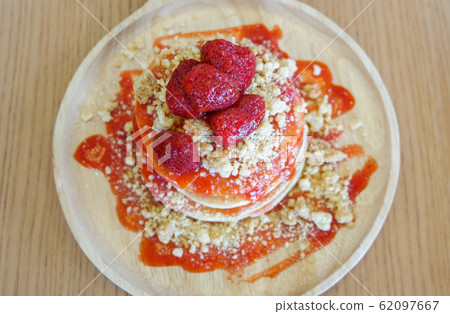 Pancakes strawberry fruit and sauce on wooden 62097667