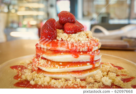 Pancakes strawberry fruit and sauce on wooden Pancakes strawberry fruit and sauce on wooden 62097668