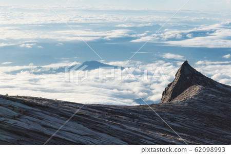 South Peak over clouds in the morning on Kota Kinabalu mountain in Malaysia 62098993
