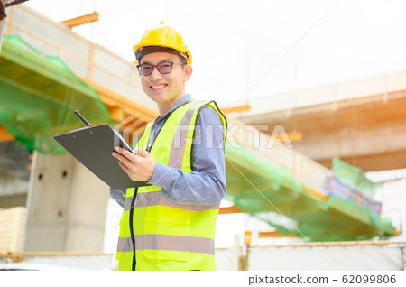 Young asian engineers are working on the construction site 62099806