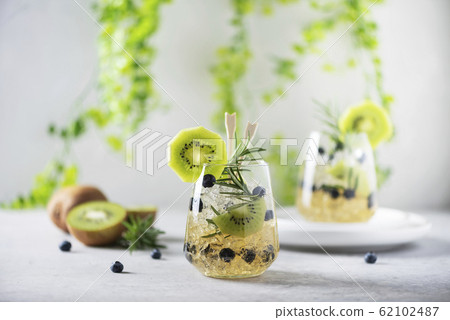 Summer cocktail with kiwi 62102487