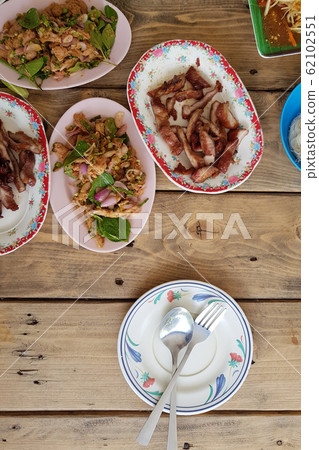 Traditional Thai spicy papaya salad, Grilled pork Traditional Thai spicy papaya salad, Grilled pork 62102551