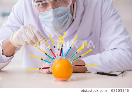 Male nutrition expert testing food products in lab Male nutrition expert testing food products in lab 62105346