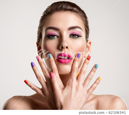 Beautiful fashion woman with a colored nails. 62106341