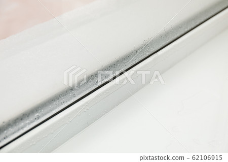 Plastic window with damp and water condensation Plastic window with damp and water condensation 62106915
