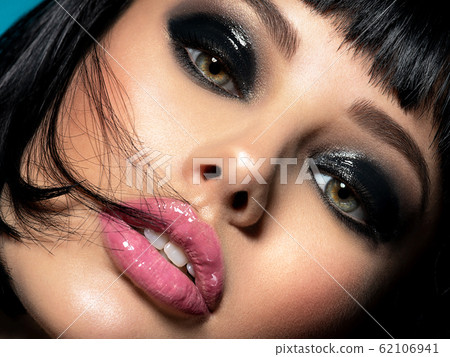 face of a sexy fashion model with black makeup face of a sexy fashion model with black makeup 62106941