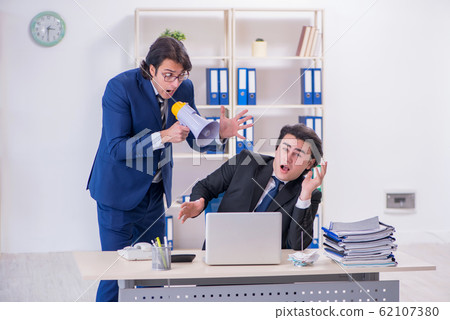 Boss and his male assistant working in the office Boss and his male assistant working in the office 62107380
