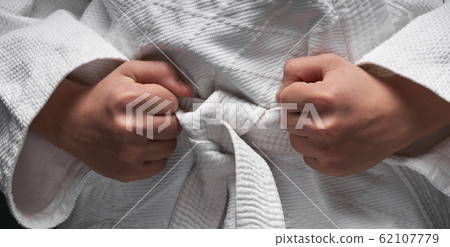 portrait of a teenager dressed in martial arts portrait of a teenager dressed in martial arts 62107779