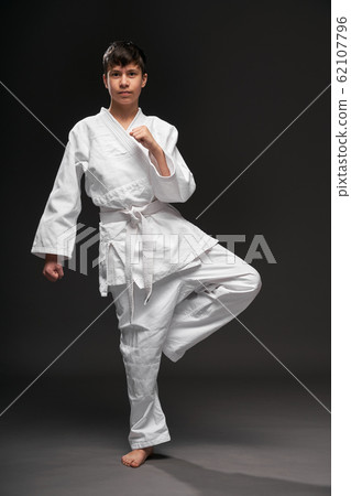 portrait of a teenager dressed in martial arts portrait of a teenager dressed in martial arts 62107796
