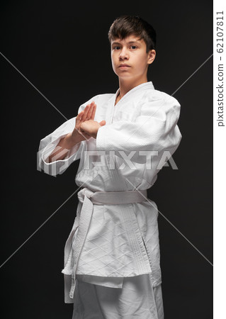 portrait of a teenager dressed in martial arts portrait of a teenager dressed in martial arts 62107811