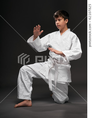 portrait of a teenager dressed in martial arts 62107825