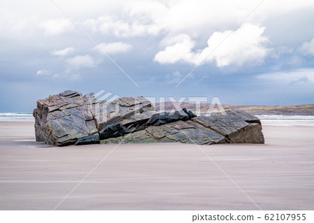 Huge rock on Maghera beach near Ardara County Donegal in Ireland. Huge rock on Maghera beach near Ardara County Donegal in Ireland. 62107955