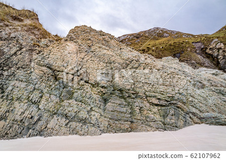 Layers of schist found in the rocks of Maghera beach near Ardara County Donegal in Ireland. Layers of schist found in the rocks of Maghera beach near Ardara County Donegal in Ireland. 62107962