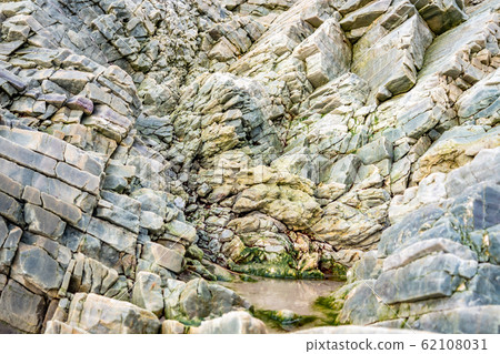 Layers of schist found in the rocks of Maghera beach near Ardara County Donegal in Ireland. Layers of schist found in the rocks of Maghera beach near Ardara County Donegal in Ireland. 62108031