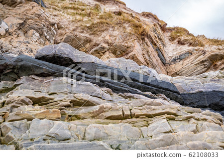 Layers of schist found in the rocks of Maghera beach near Ardara County Donegal in Ireland. Layers of schist found in the rocks of Maghera beach near Ardara County Donegal in Ireland. 62108033