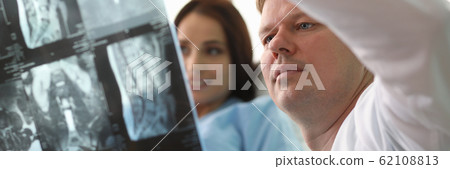 Therapist holding x-ray Therapist holding x-ray 62108813
