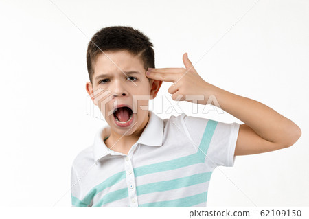 little boy in t-shirt shooting in temple with hand little boy in t-shirt shooting in temple with hand 62109150