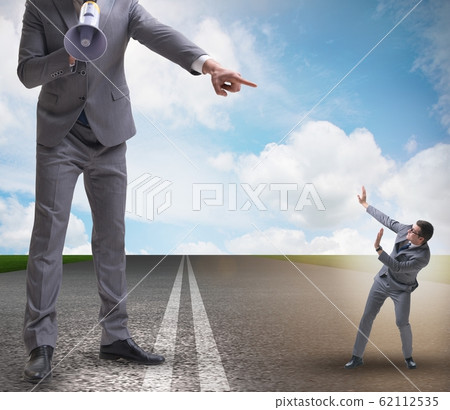 The bad angry boss shouting at employee with loudspeaker 62112535