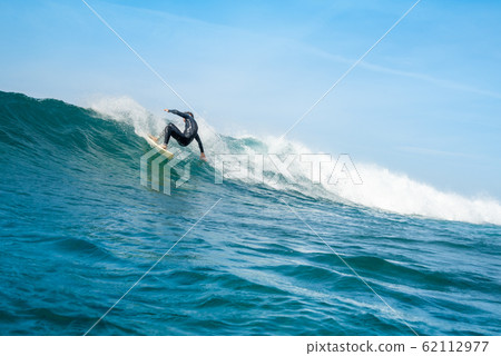 surfer riding waves on the island of fuerteventura surfer riding waves on the island of fuerteventura 62112977