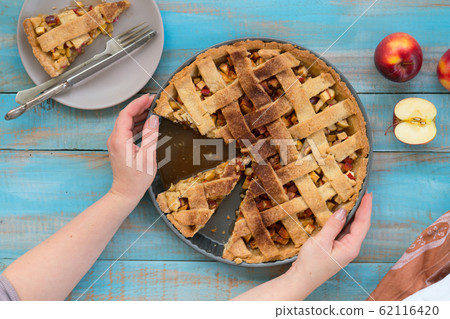Home-baked lattice apple pie, in a baking dish. Home-baked lattice apple pie, in a baking dish. 62116420