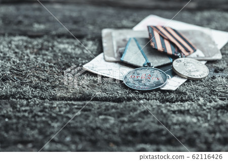 The Old Soviet Medal - For Bravery of the Second World War on natural moss background, Victory Day May 9 62116426