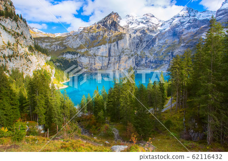 Panorama of Oeschinensee lake and Alps, Switzerland. 62116432