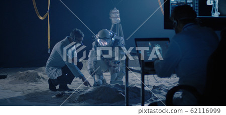 Astronaut and scientists testing sample collection 62116999