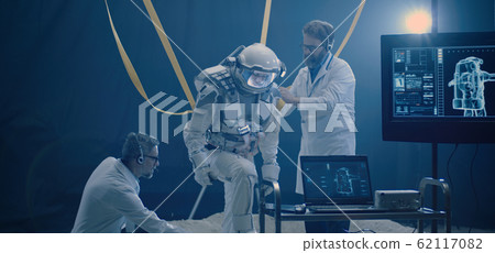 Astronaut and scientists preparing for zero gravity test Astronaut and scientists preparing for zero gravity test 62117082