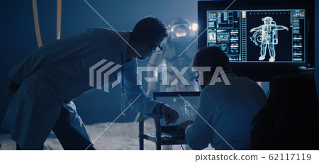 Astronaut and scientists testing spacesuit mobility 62117119