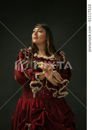 Medieval young woman in old-fashioned costume Medieval young woman in old-fashioned costume 62117828